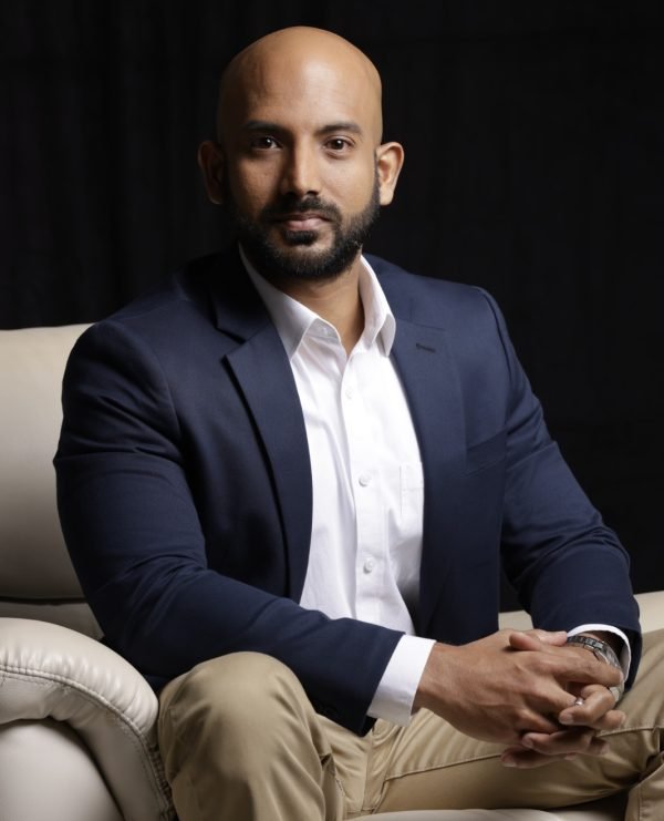 Salman Faiz, ACCA lecturer and finance professional seated in a professional setting, Colombo Sri Lanka